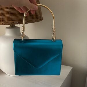 Elegant Blue Handbag with Gold Handle